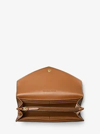 Grand portefeuille enveloppe Jet Set Travel en cuir gaufré à logo