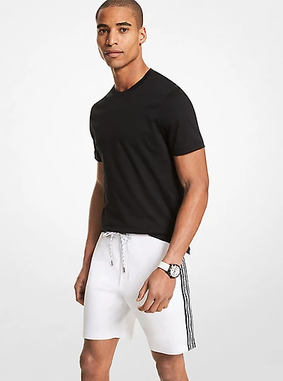 Short de jogging en mélange coton à bande logo