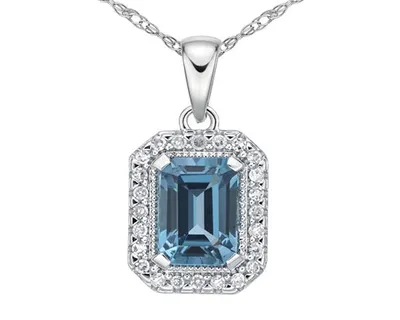 10K White Gold 7x5mm Emerald Cut London Blue Topaz and 0.09cttw Diamond Halo Necklace, 18"