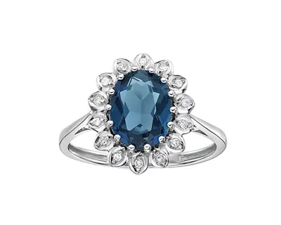 10K White Gold 9x7mm Oval Cut Sky Blue Topaz and 0.07cttw Diamond Halo Ring - Size 7