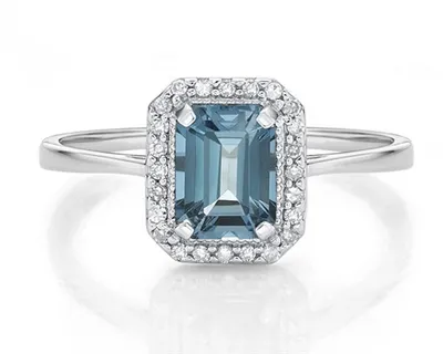 10K White Gold 7x5mm Emerald Cut London Blue Topaz and 0.096cttw Diamond Ring - Size 7