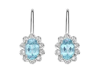 10K White Gold 6x4mm Oval Cut Swiss Blue Topaz and 0.083cttw Diamond Dangle Earrings