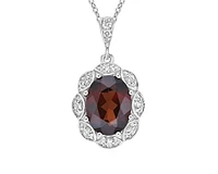 10K White Gold 8x6mm Oval Cut Garnet and 0.06cttw Diamond Scallop Halo Pendant - 18 inches