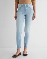 Mid Rise Light Wash Raw Drop Hem Skinny Jeans