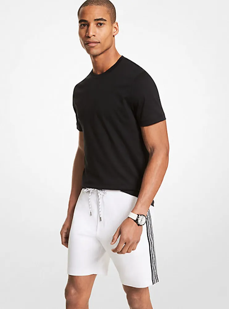 Short de jogging en mélange coton à bande logo