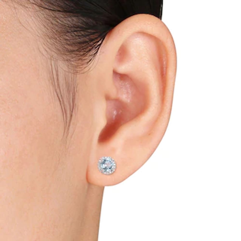 5.0mm Sky Blue Topaz and 0.07 CT. T.W. Diamond Frame Stud Earrings in Sterling Silver|Peoples Jewellers
