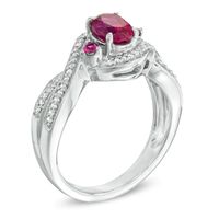 Oval Lab-Created Ruby and 0.16 CT. T.W. Diamond Swirl Ring in Sterling Silver|Peoples Jewellers