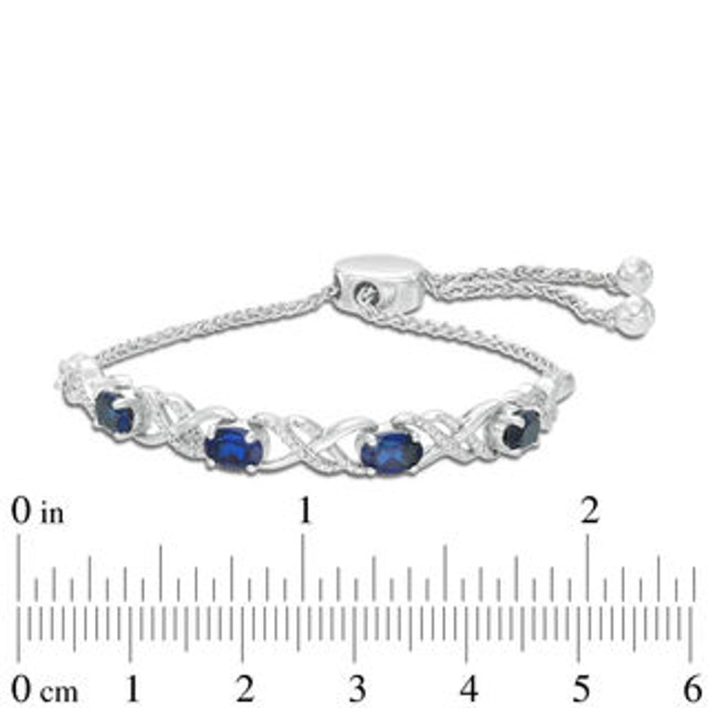 Oval Lab-Created Blue Sapphire and 0.09 CT. T.W. Diamond Infinity Bolo Bracelet in Sterling Silver - 9.5"|Peoples Jewellers