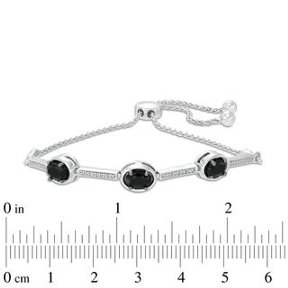 Oval Onyx and 0.09 CT. T.W. Diamond Three Stone Bar Bolo Bracelet in Sterling Silver - 9.5"|Peoples Jewellers