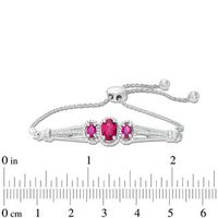 Oval Lab-Created Ruby and 0.18 CT. T.W. Diamond Three Stone Bolo Bracelet in Sterling Silver - 9.5"|Peoples Jewellers