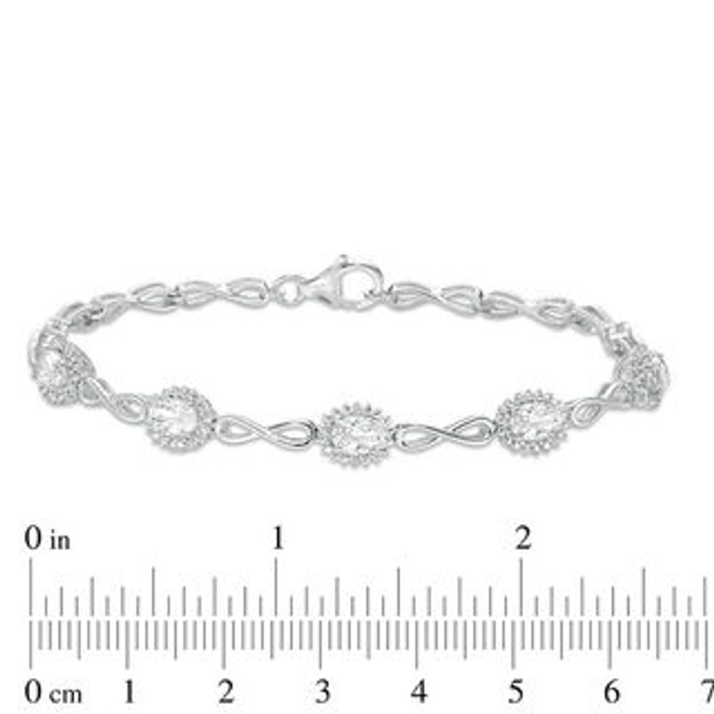 Oval Lab-Created White Sapphire Sunburst Frame and Infinity Link Bracelet in Sterling Silver - 7.5"|Peoples Jewellers