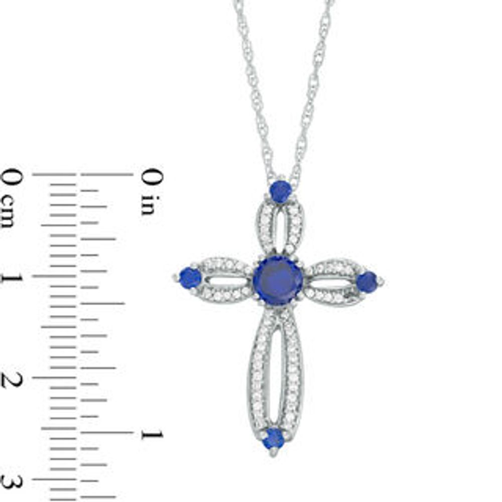 5.0mm Lab-Created Blue Sapphire and 0.18 CT. T.W. Diamond Loop Cross Pendant in Sterling Silver|Peoples Jewellers