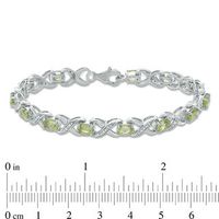 Oval Peridot and 0.11 CT. T.W. Diamond "XO" Bracelet in Sterling Silver - 7.25"|Peoples Jewellers