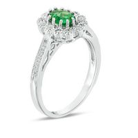 Oval Lab-Created Emerald and 0.15 CT. T.W. Diamond Flower Frame Engagement Ring in Sterling Silver|Peoples Jewellers