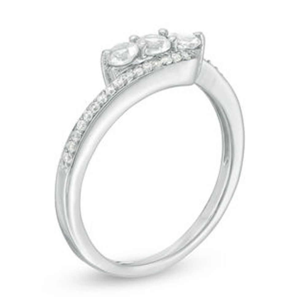 Lab-Created White Sapphire and 0.15 CT. T.W. Diamond Three Stone Bypass Ring in Sterling Silver|Peoples Jewellers