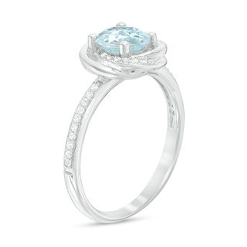 6.0mm Sky Blue Topaz and 0.15 CT. T.W. Diamond Orbit Frame Ring in 10K White Gold|Peoples Jewellers