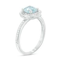 6.0mm Sky Blue Topaz and 0.15 CT. T.W. Diamond Orbit Frame Ring in 10K White Gold|Peoples Jewellers