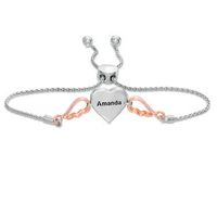 1/15 CT. T.W. Diamond Double Heart with Wings Bolo Bracelet in Sterling Silver and 10K Rose Gold (1 Line) - 9.5"|Peoples Jewellers