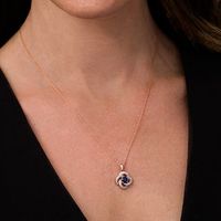 5.0mm Lab-Created Blue Sapphire and 0.145 CT. T.W. Diamond Flower Swirl Frame Pendant in 10K Rose Gold|Peoples Jewellers