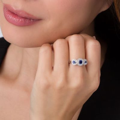Bezel-Set Lab-Created Blue and White Sapphire Frame Three Stone Ring in Sterling Silver|Peoples Jewellers