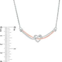 0.147 CT. T.W. Diamond Love Knot Heart Curved Bar Necklace in Sterling Silver and 10K Rose Gold - 16.37"|Peoples Jewellers