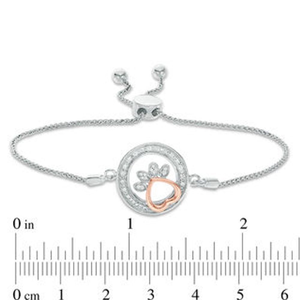 0.065 CT. T.W. Diamond Open Circle Paw Print Bolo Bracelet in Sterling Silver and 10K Rose Gold - 9.5"|Peoples Jewellers