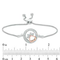 0.065 CT. T.W. Diamond Open Circle Paw Print Bolo Bracelet in Sterling Silver and 10K Rose Gold - 9.5"|Peoples Jewellers