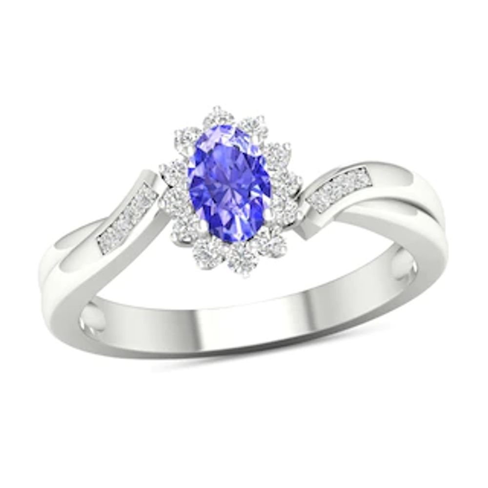 Oval Tanzanite and 0.12 CT. T.W. Diamond Sunburst Frame Twist Shank Ring in 10K White Gold|Peoples Jewellers