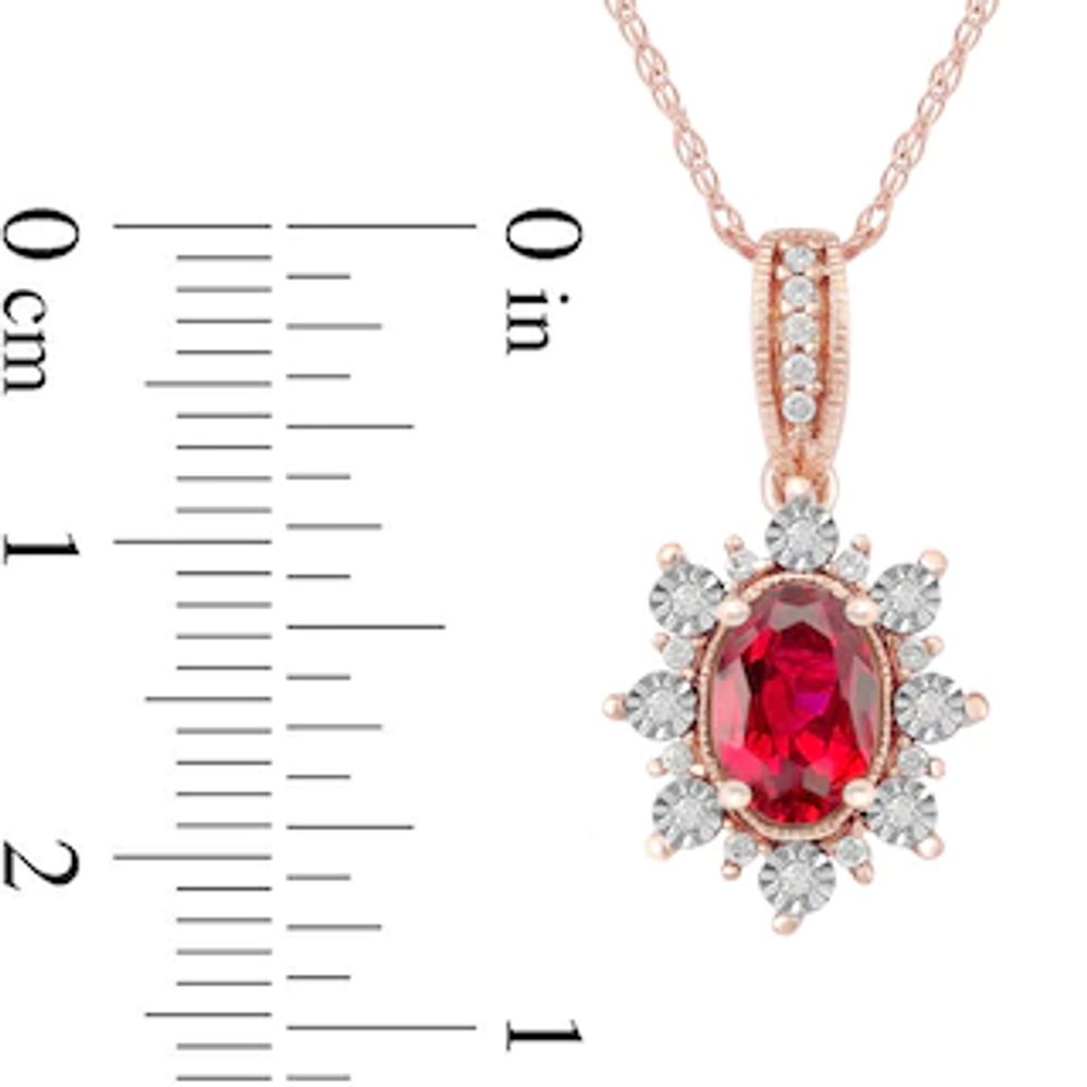 Oval Ruby and 0.08 CT. T.W. Diamond Sunburst Frame Vintage-Style Drop Pendant in 10K Rose Gold|Peoples Jewellers