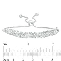 0.09 CT. T.W. Diamond Cascading Infinity with Flowers Bolo Bracelet in Sterling Silver - 9.5"|Peoples Jewellers