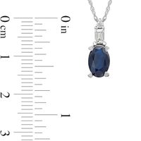 Oval Blue Sapphire and 0.05 CT. T.W. Baguette and Round Diamond Stacked Top Accent Pendant in 10K White Gold|Peoples Jewellers