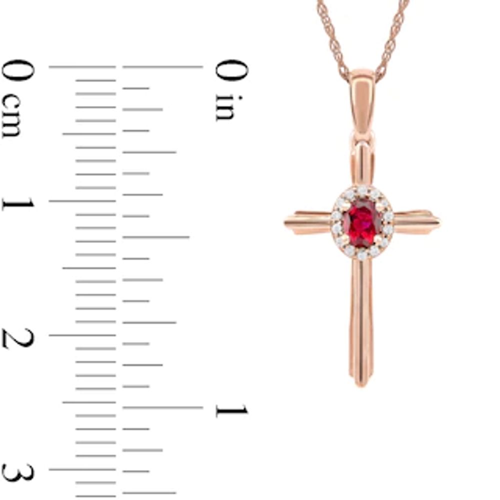 Oval Ruby and 0.04 CT. T.W. Diamond Frame Layered Cross Pendant in 10K Rose Gold|Peoples Jewellers