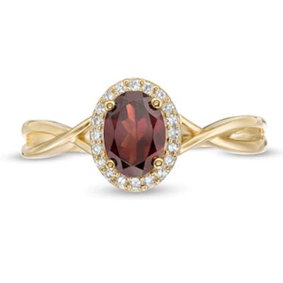 Oval Garnet and 0.08 CT. T.W. Diamond Frame Twist Shank Ring in 10K Gold|Peoples Jewellers