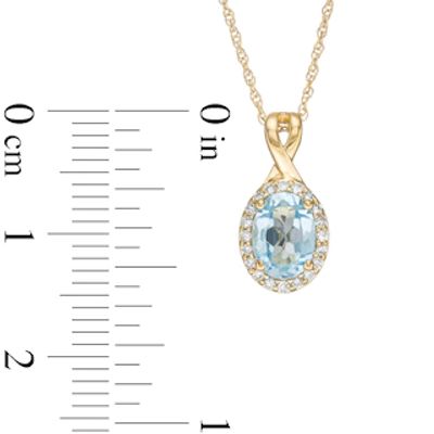 Oval Swiss Blue Topaz and 0.08 CT. T.W. Diamond Frame Twisted Split Bail Pendant in 10K Gold|Peoples Jewellers