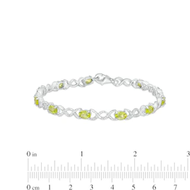 Oval Peridot and 0.18 CT. T.W. Diamond Infinity Ribbon Link Line Bracelet in Sterling Silver – 7.5"|Peoples Jewellers