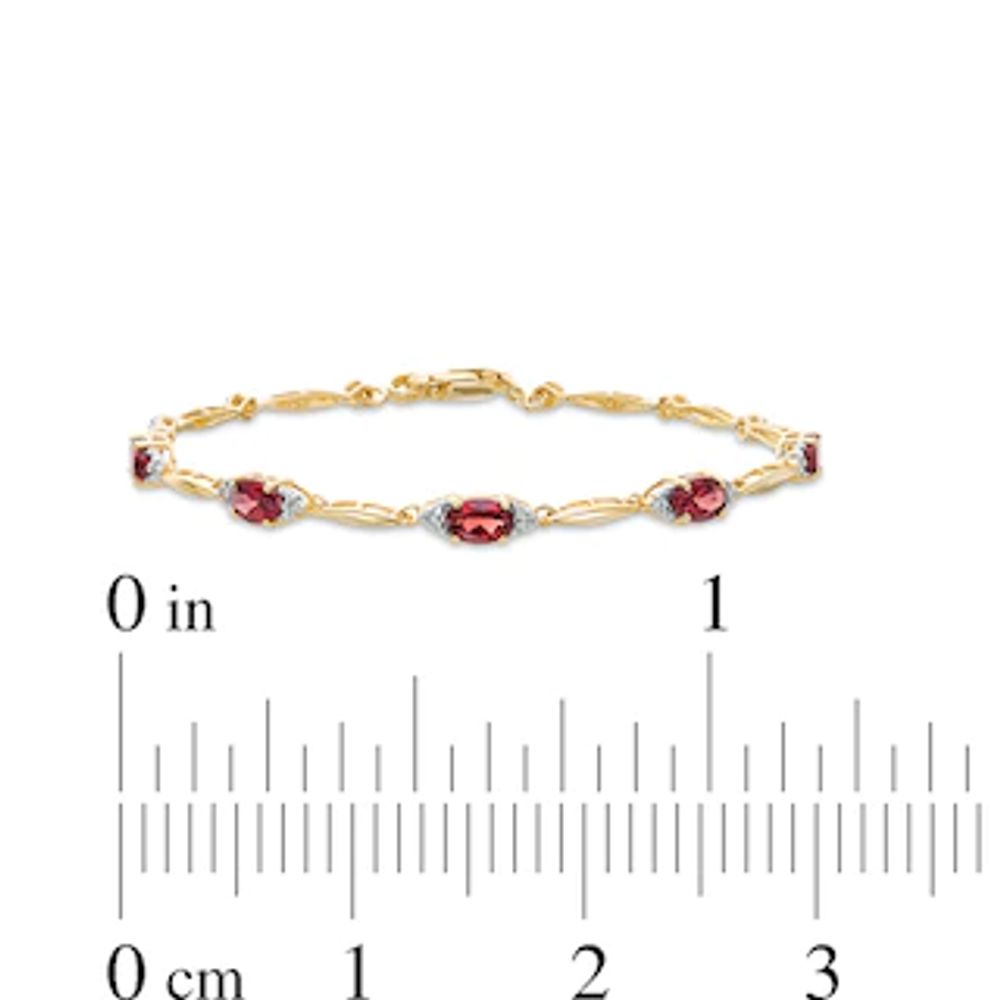Previously Owned - Oval Garnet and Diamond Accent Bracelet in Sterling Silver with 10K Gold Plate - 7.25"|Peoples Jewellers