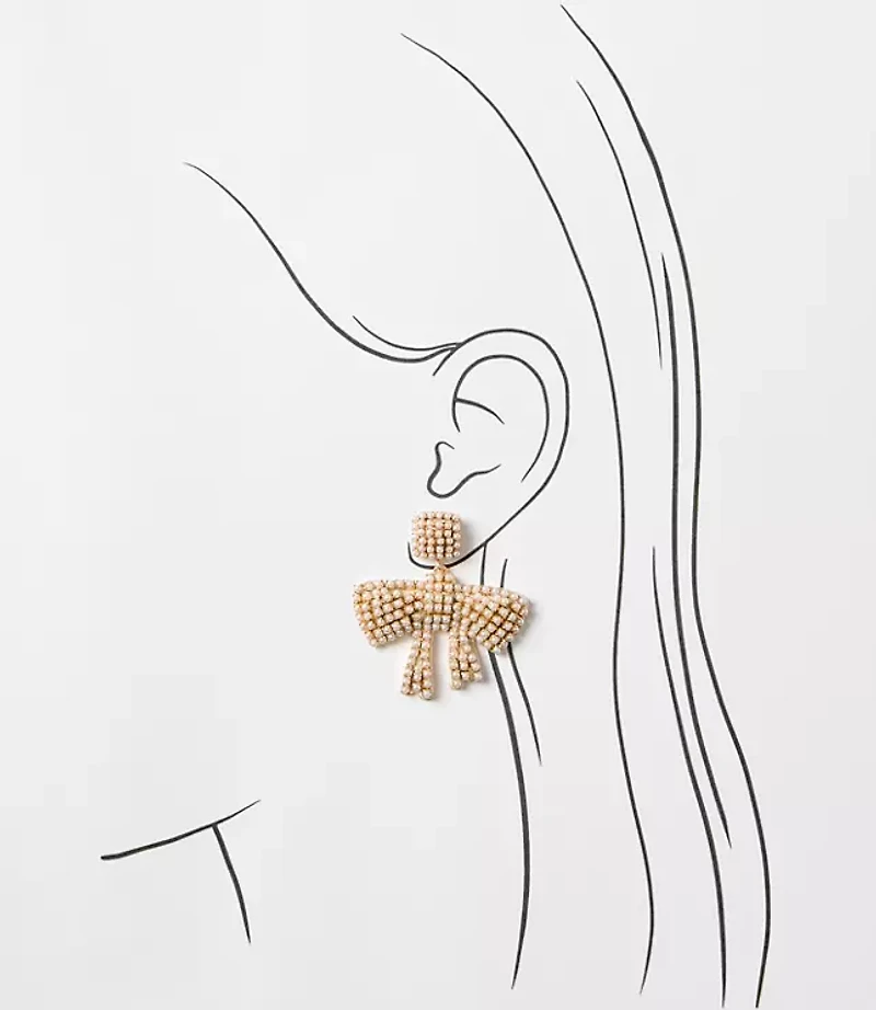 Pearlized Bow Statement Earrings