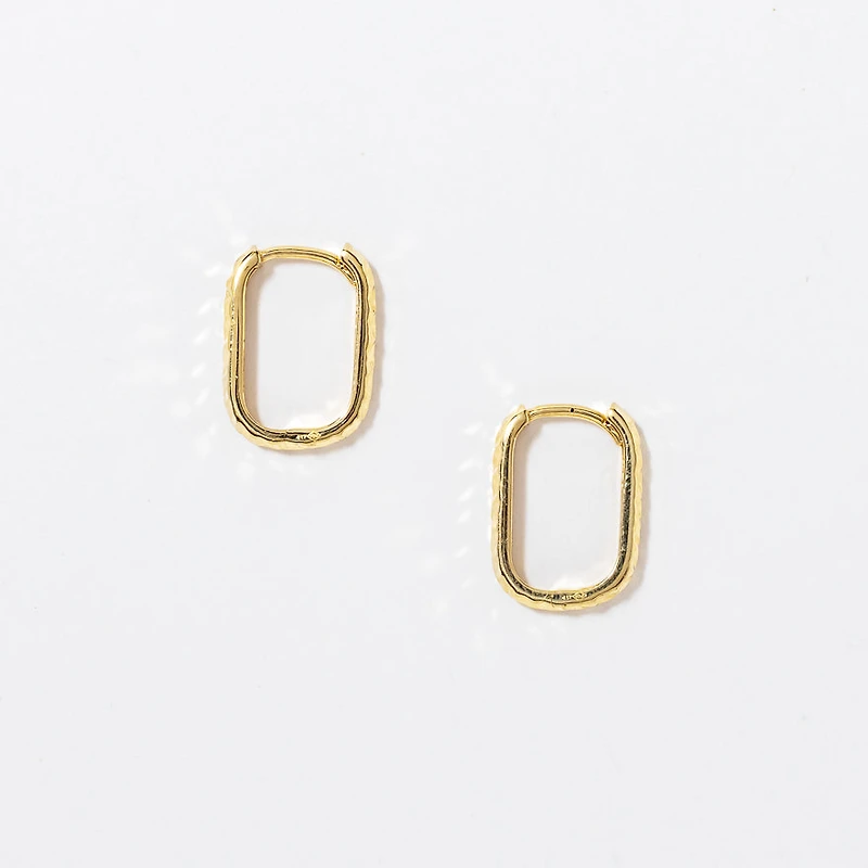 Diamond Cut Oval Huggie Earrings in 10K Yellow Gold