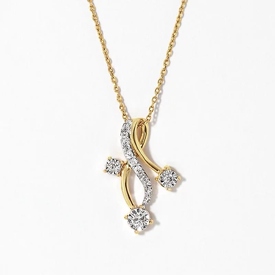 Swirl Diamond Pendant in 10K Yellow and White Gold (0.20 ct tw)