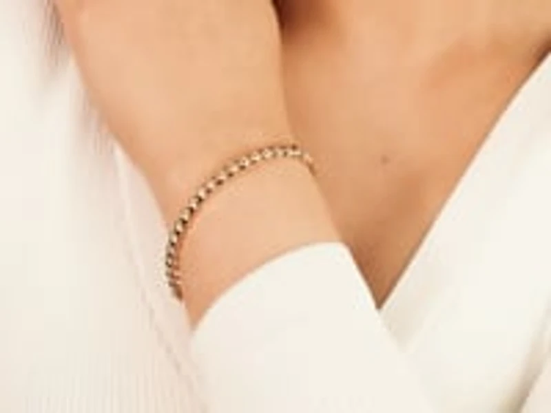 Wavy Oval Bangle in 10K Yellow Gold