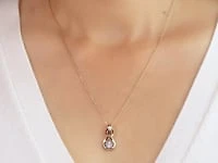 Diamond Knot Necklace in 10K Yellow and White Gold (0.06 ct tw)