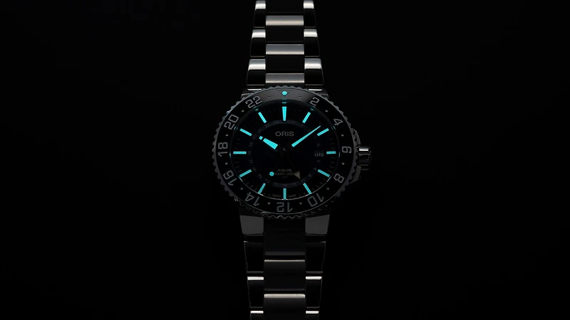 Aquis GMT Date
