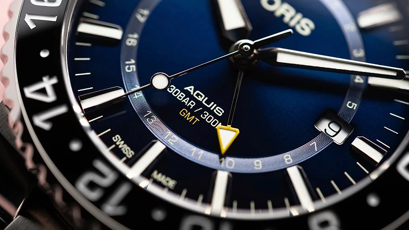 Aquis GMT Date