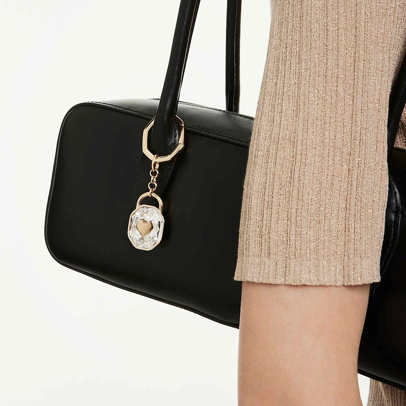 Key ring, Oval cut, White, Gold-tone plated by SWAROVSKI