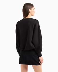 Oversized sweatshirt with wavy bottom and rhinestones