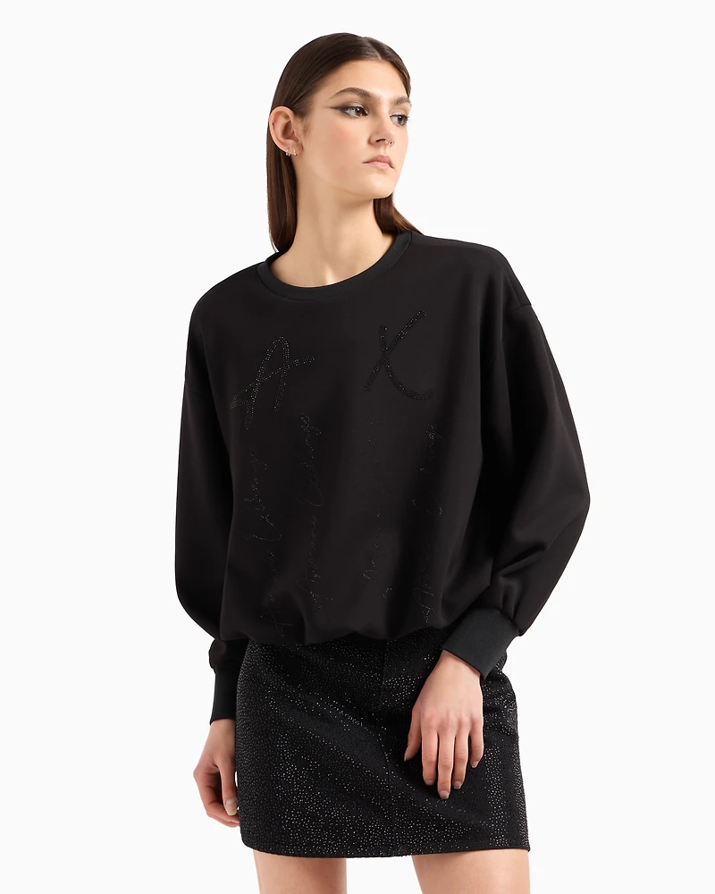 Oversized sweatshirt with wavy bottom and rhinestones