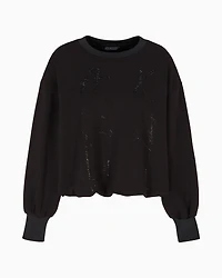 Oversized sweatshirt with wavy bottom and rhinestones