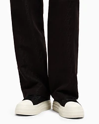 Pleated trousers with allover logo