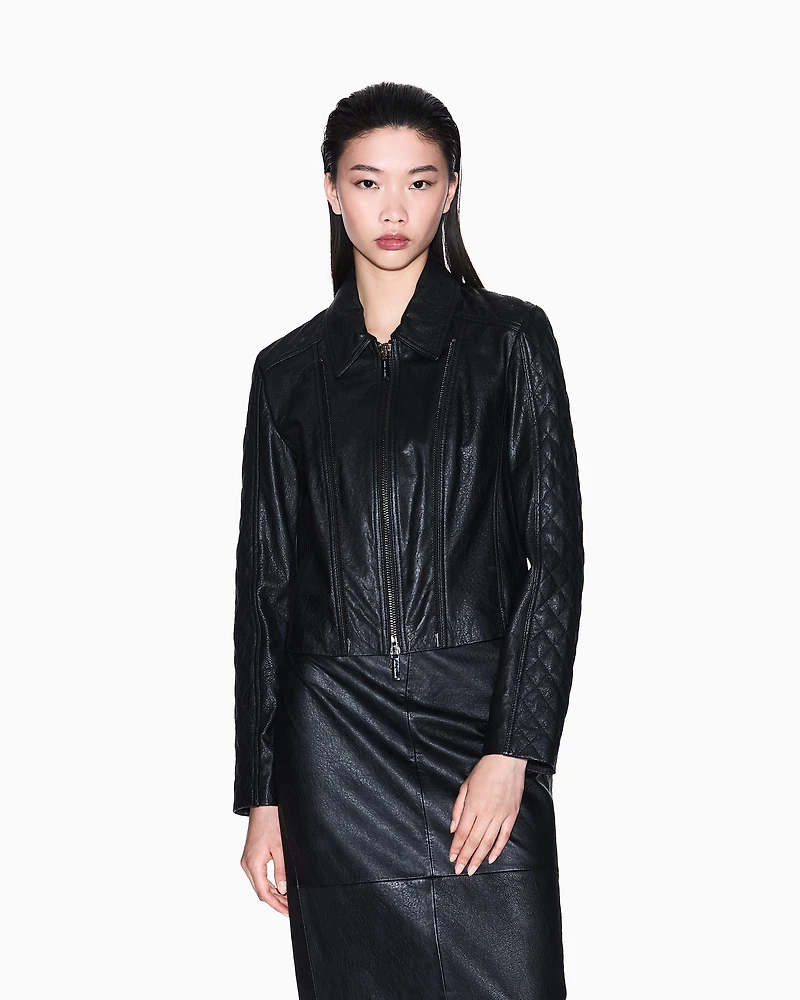 Leather jacket with quilted sleeves