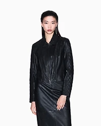 Leather jacket with quilted sleeves